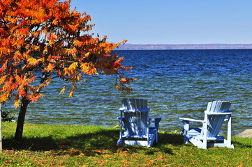 Wall Mural - Wooden chairs on autumn lake