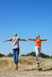 © hartphotography - Happy couple balancing together