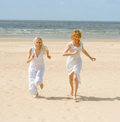 Sticker - Girls running on a beach