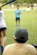© palangsi - Family playing softball together, focus on father wearing cap
