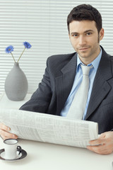 Businessman reading news