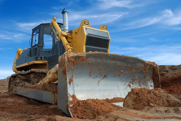 Poster - Close-up view of heavy bulldozer standing in sandpit