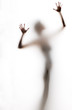 abstract, elongated, semi-obscured figure with arms raised