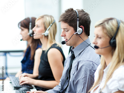 Fotografía Attractive young man working in a call center