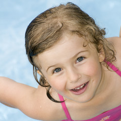 Wall Mural - Little girl in water  portrait