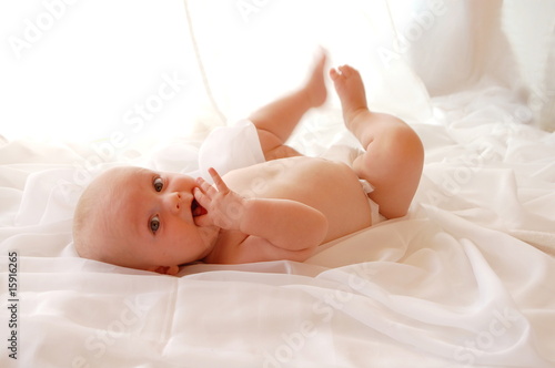 Baby Dreht Sich Auf Weissem Tuch Buy This Stock Photo And Explore