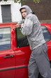 © Monkey Business - Young Man Breaking Into Car