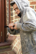 © Monkey Business - Young Man Breaking Into House