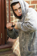 © Monkey Business - Young Man Breaking Into House