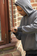 © Monkey Business - Young Man Breaking Into House