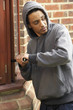 © Monkey Business - Young Man Breaking Into House