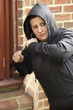 © Monkey Business - Young Woman Breaking Into House