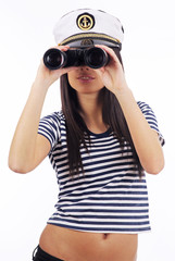 Poster - Close-up portrait of a woman as a sea captain holding binocular