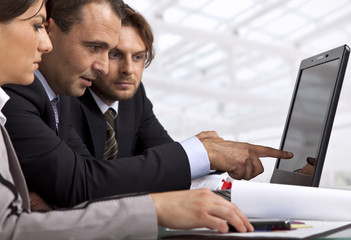 three business people working