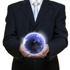 Businessman holding blue planet full of lights