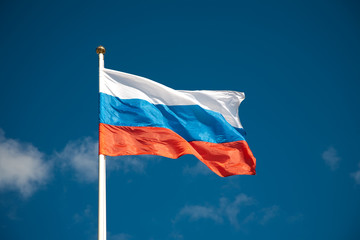 Russian flag against blue sky