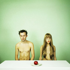 Two nude lovers with apple