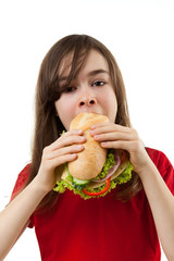 Wall Mural - Kid eating healthy sandwich isolated on white