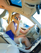 © bertys30 - blonde woman driving and talking to mobile phone