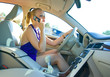 © bertys30 - blonde woman driving and talking to mobile phone