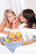 © CandyBox Images - Two happy young women having breakfast