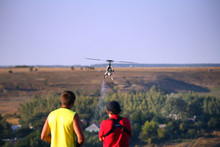 Two Guys Compete On Radio Controlled Helicopter