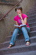 © bertys30 - teen girl with book on the stairs