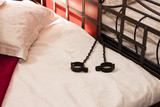 Fototapeta  - A metal bed with  handcuffs