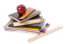 Apple And School Supplies On A White Background
