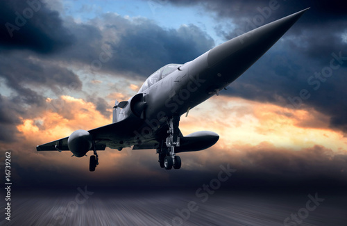 Cuadros en Lienzo Military airplane on sunset sky