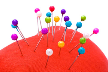 colorful pins on cushion