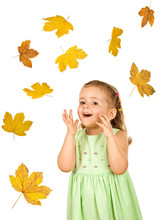Happy Surprised Little Girl With Falling Autumn Leaves