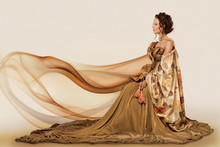 Woman Sitting In A Formal Full Flowing Gown