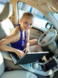 © bertys30 - woman with laptop in the car