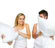 © WavebreakMediaMicro - Beautiful woman having a pillow fight with a man