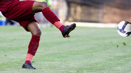 Soccer player kicking the ball