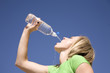 © Poulsons Photography - Woman and water bottle blue sky