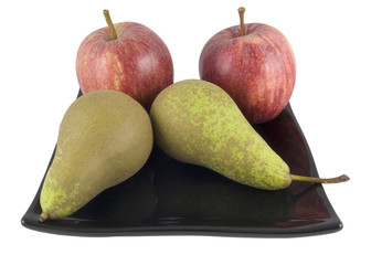 two apples and pears on black plate isolated on white