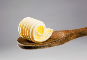 Poster - Butter curl on a wooden spoon