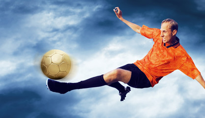 Wall Mural - Shoot of football player on the sky with clouds