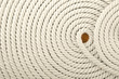 Heavy, white coiled rope.