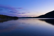 Blue Cold Sunrise Over Lake In Sweden