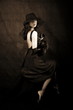 © konstantant - girl with hat against black background