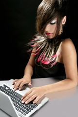 Wall Mural - Attractive brunette fashion woman with laptop