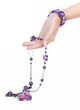 Purple jewlry and bracelet with human hand