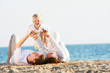 © Alena Yakusheva - happy family having fun on beach