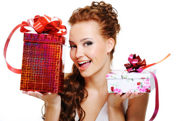 Happy woman choosing between two presents