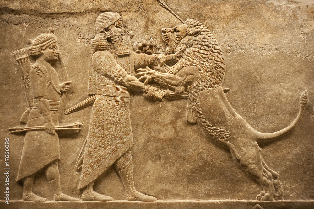 Assirian warrior hunting lions - obrazy, fototapety, plakaty 