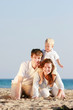 © Alena Yakusheva - happy family on beach