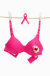 © Arto - Broken pink bra with ribbon for breast cancer concept